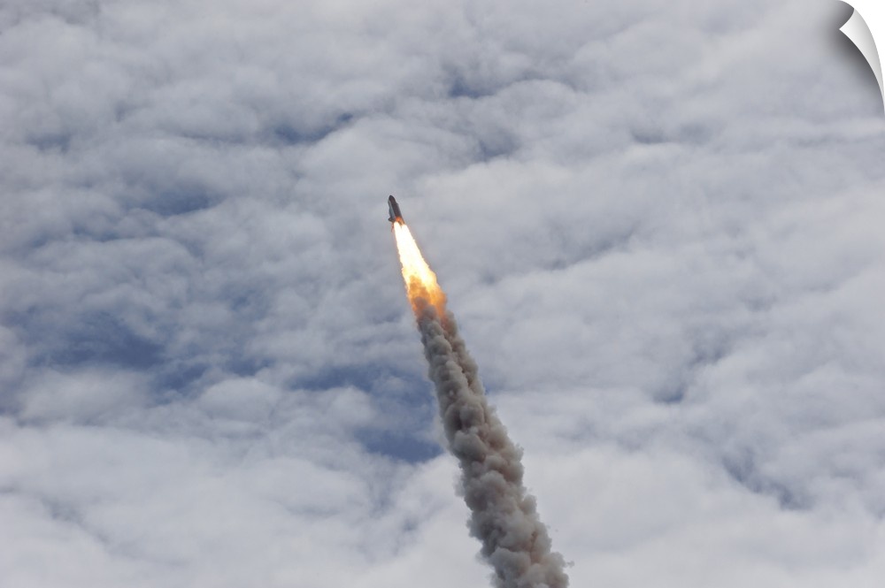 July 8, 2011 - Space shuttle Atlantis just before it disappears into the clouds, Cape Canaveral, Florida.