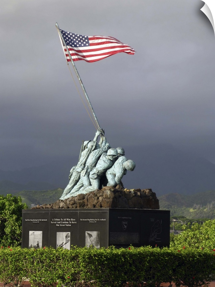 Big, vertical photograph of the Iwo Jima Statue, of a small group of soldiers hoisting the American Flag.  The statue is s...