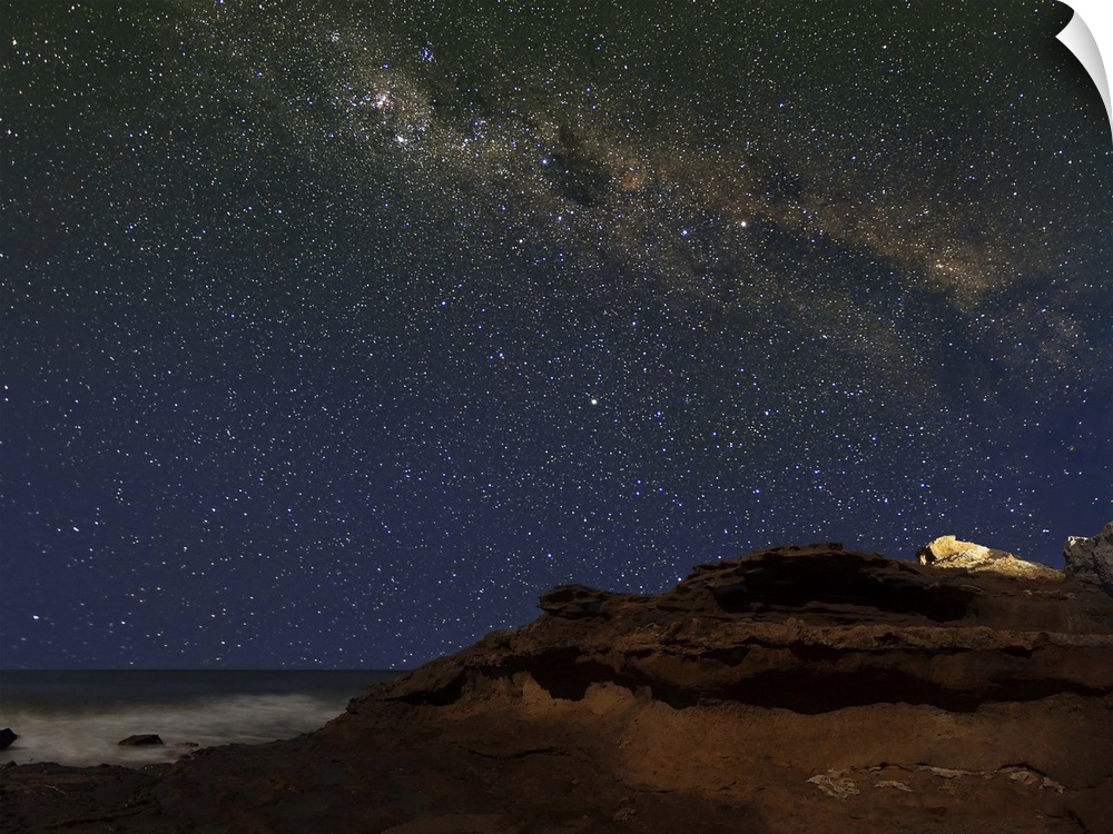 The Milky Way showing the figure known as The Emu rising over the cliffs in Miramar, Argentina.