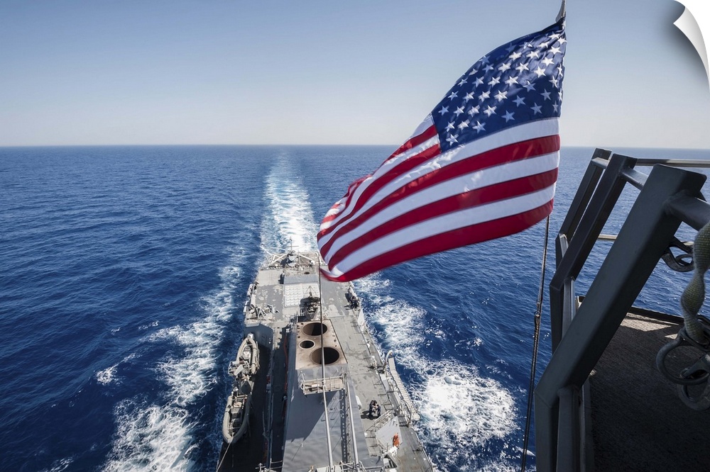 May 23, 2013 - The national ensign flies from the mast aboard the guided-missile destroyer USS Stockdale.