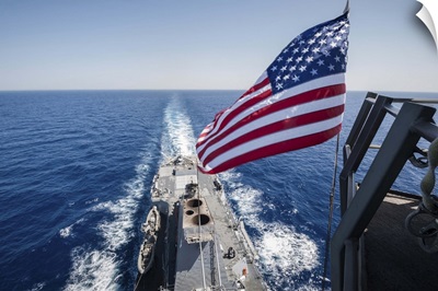 The national ensign flies from the mast aboard USS Stockdale