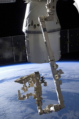The SpaceX Dragon commercial cargo craft berthed to the ISS