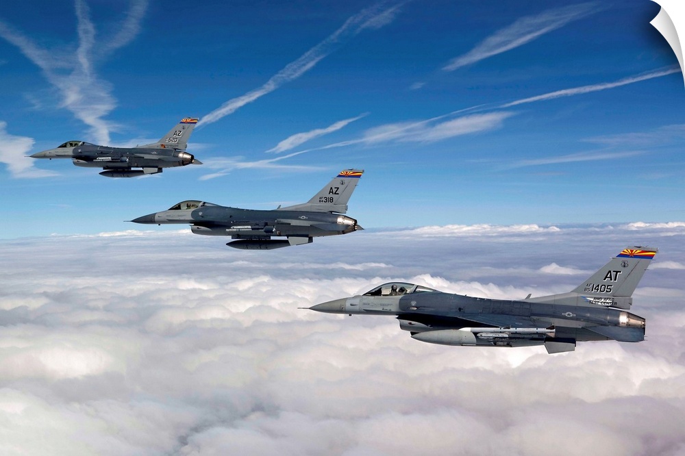 Three F-16's stationed at the 162nd Fighter Wing in Tucson, Arizona, fly in formation during a training mission.