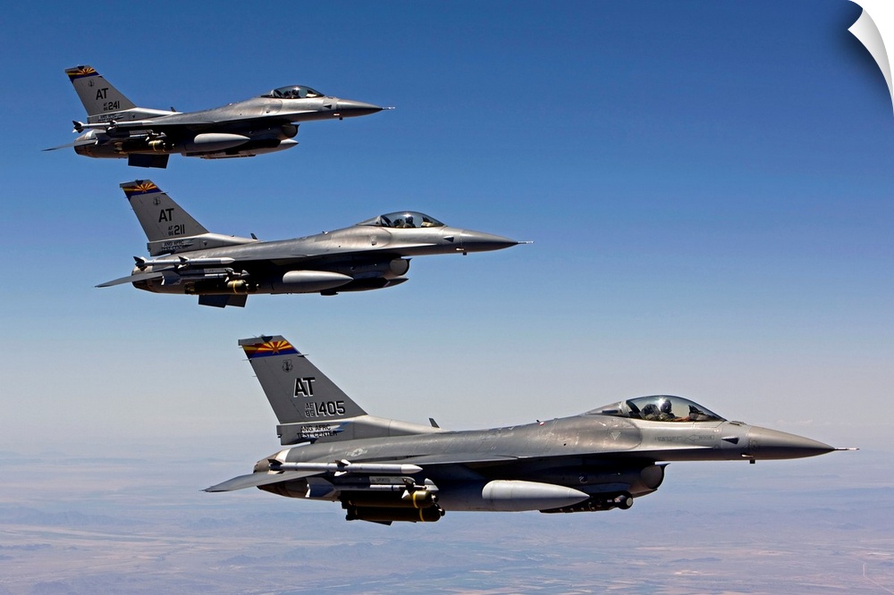 Three F-16's from the Air National Guard Air Force Reserve Test Center fly in formation during a test mission out of Tucso...