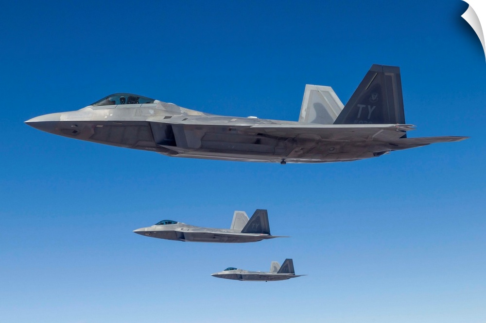 Three U.S. Air Force F-22 Raptors cruise above Nevada.