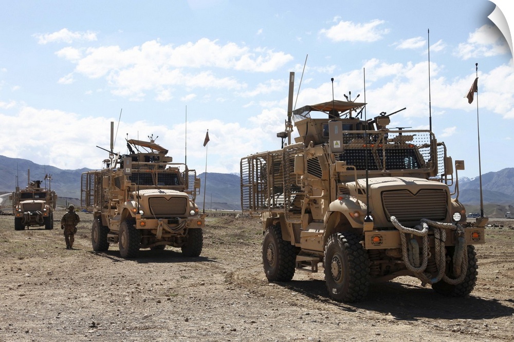 May 12, 2012 - Three U.S. Army Mine Resistant Ambush Protected vehicles provide security during a key leaders engagement a...