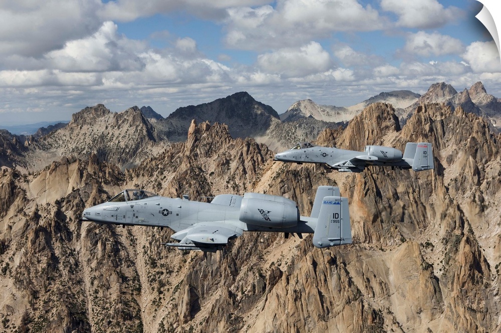 Two A-10 Thunderbolt's from the 124th Fighter Wing's 190th Fighter Squadron fly the jagged peaks of the Sawtooth Mountains...