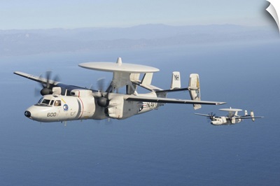 Two E-2C Hawkeye aircraft fly over the Pacific Ocean