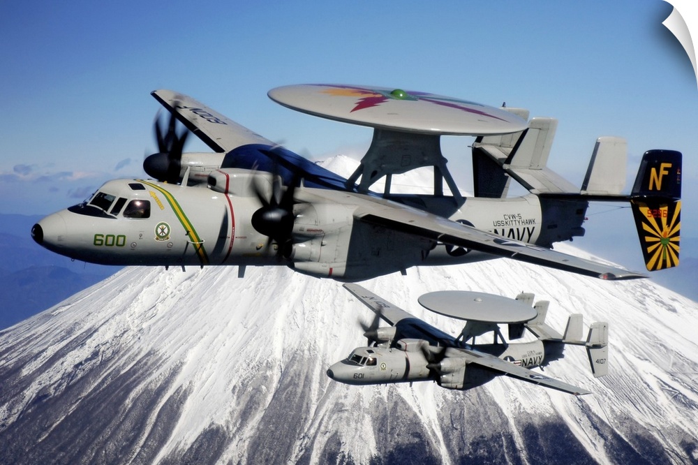 Two E2C Hawkeyes conduct a flyby of Mount Fuji in Japan