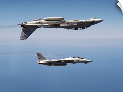 Two F-14A Tomcats perform aerobatics above the Pacific Ocean