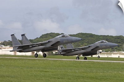 Two F-15 Eagles take off in formation from Kadena Air Base, Japan