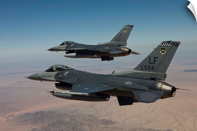 Two F-16s fly in formation over Arizona