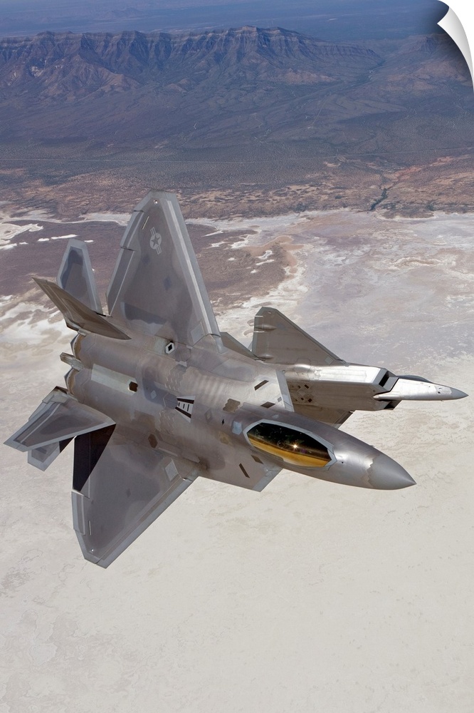Two F-22 Raptors from the 49th Fighter Wing manuever while on a training mission out of Holloman Air Force Base, New Mexico.