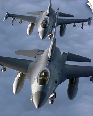 Two F16 Fighting Falcons fly in formation