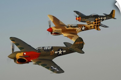 Two P-40 Warhawks and a P-51D Mustang flying over Chino, California
