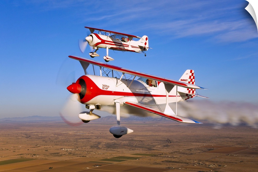 Two Pitts Model 12 aircraft in flight over Chandler, Arizona.