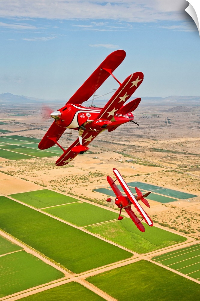 Two Pitts Special S-2A aerobatic biplanes in flight near Chandler, Arizona.