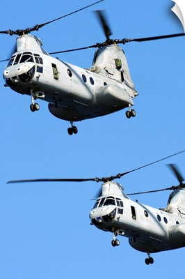 Two U.S. Marine Corps CH 46E Sea Knight helicopters in flight