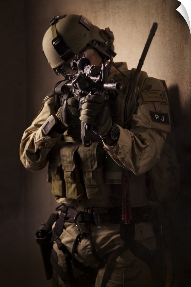 U.S. Air Force CSAR parajumper armed with an automatic rifle.