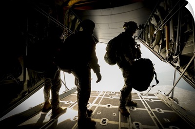 U.S. Army Green Berets wait to jump out of a C-130H3 Hercules