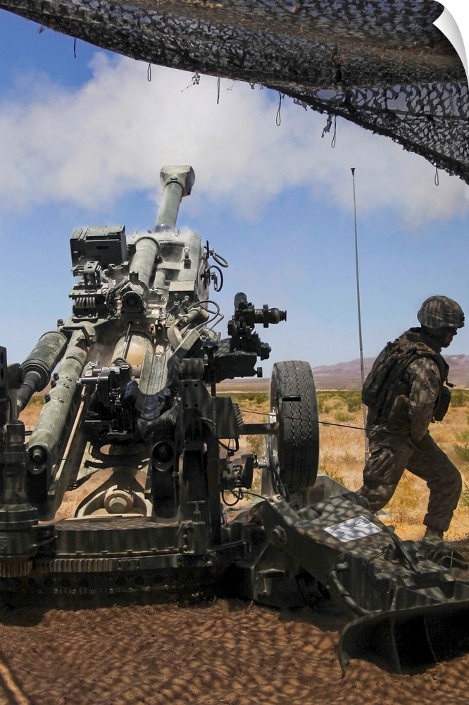 July 23, 2010 - U.S. Marines fire an M777 howitzer during the training exercise Enhanced Mojave Viper at Marine Corps Base...