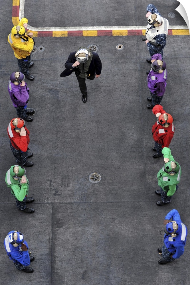 December 6, 2010 - U.S. Navy rainbow sideboys stationed aboard aircraft carrier USS Abraham Lincoln (CVN-72) greet Secreta...