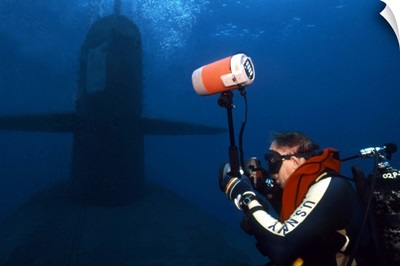 Underwater photographer takes photos of a US submarine