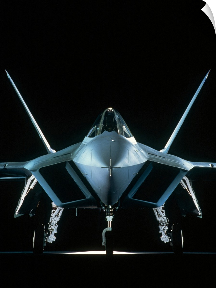Vertical photograph on a big canvas of a front view of a United States Military Aircraft, on a solid black background.