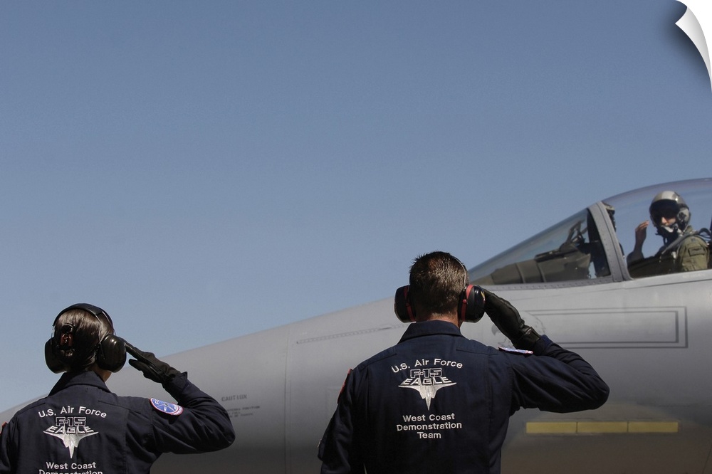 US Air Force Airmen salute the Captain of an aircraft