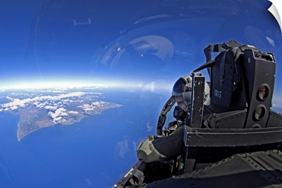 US Air Force captain looks out over the sky in a F15 Eagle