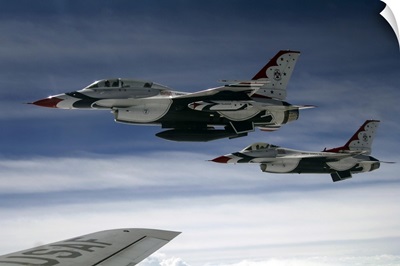 US Air Force F-16 aircraft fly off the wing of a KC-135 Stratotanker
