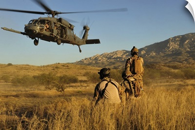 US Air Force Pararescuemen Signal In A HH-60 Pave Hawk For Extraction