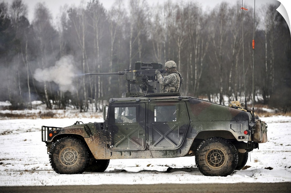 February 4, 2014 - U.S. Army paratrooper fires an M2 .50-caliber machine gun from a Humvee during a platoon-level, live-fi...