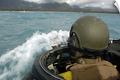 US Marine driving an amphibious assault vehicle through the Pacific Ocean