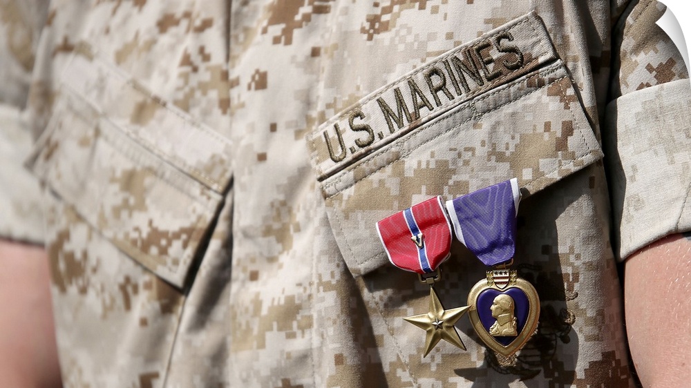 U.S. Marine wears the Bronze Star Medal with combat distinguishing device and Purple Heart after an awards ceremony.