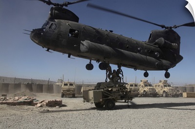 US Soldiers Attach Sling Load Ropes To An Army CH-47 Chinook