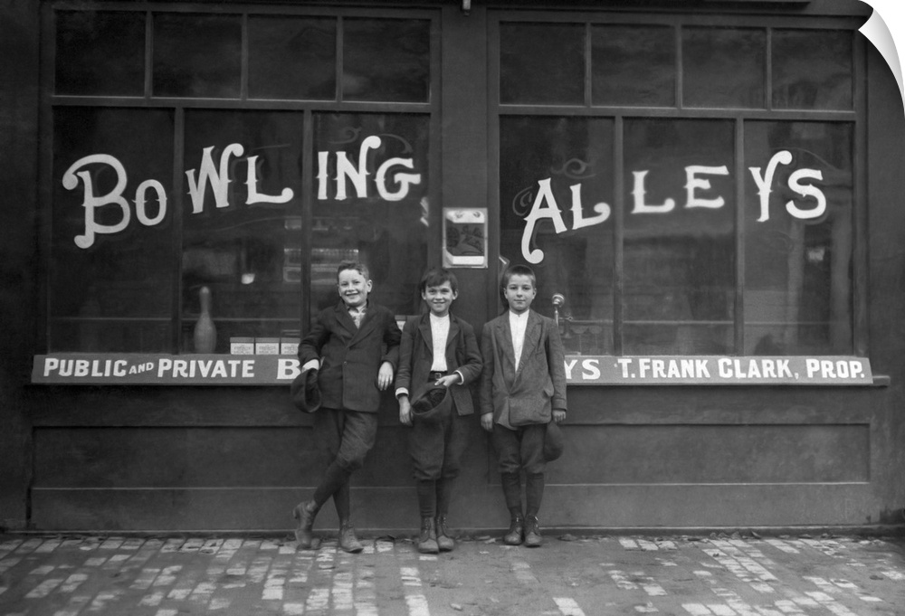 Vintage photo of a row of young boys posing in front of the Les Miserables bowling alley in Lowell, Massachusetts where th...