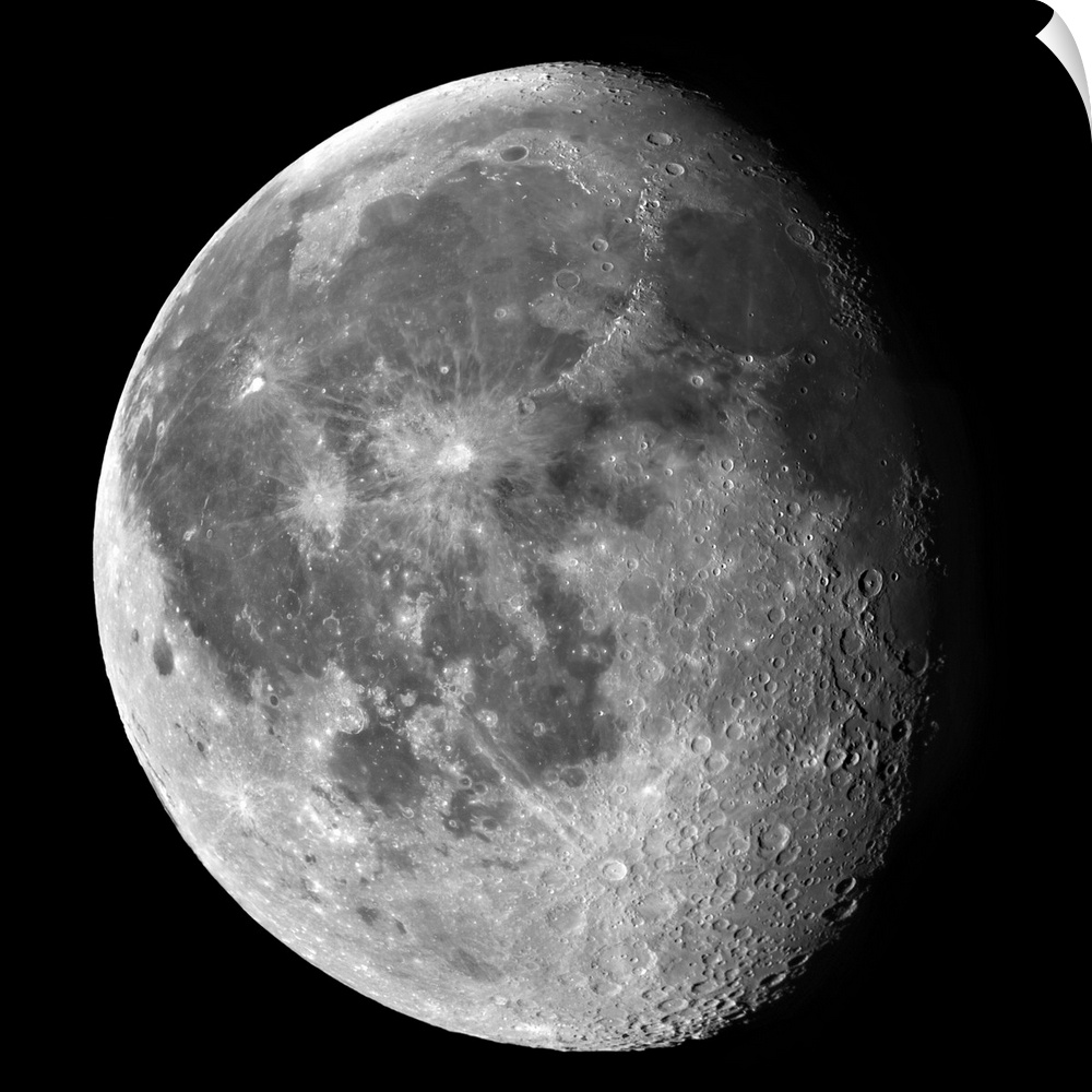 A partially shaded moon is photographed against a black background.