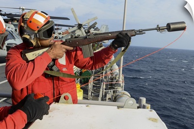 Weapons Officer Fires A Shot Line From USS Bonhomme Richard During Replenishment At Sea