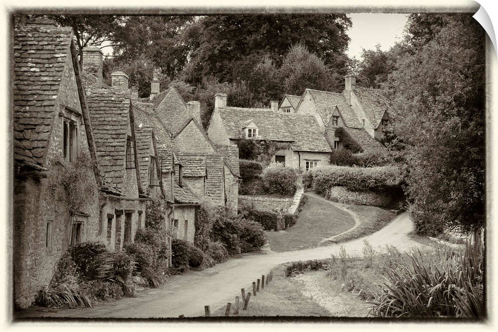Road through a quaint country village in Cotswolds, England.