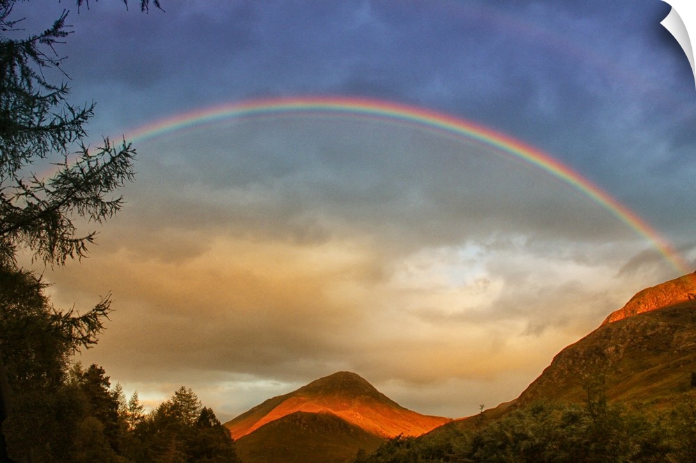 A stunning rainbow over the mountains of Glencoe, Scotland.