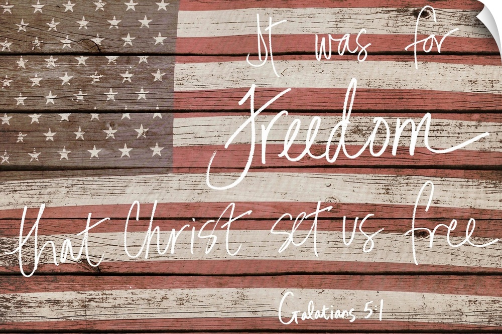 American flag on wooden board with a bible verse handwritten over it.