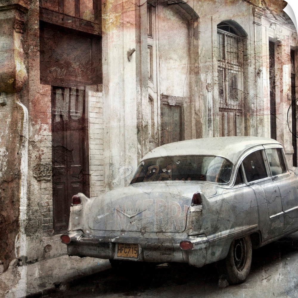 Photograph of a vintage car parked on a street, next to decayed looking buildings.