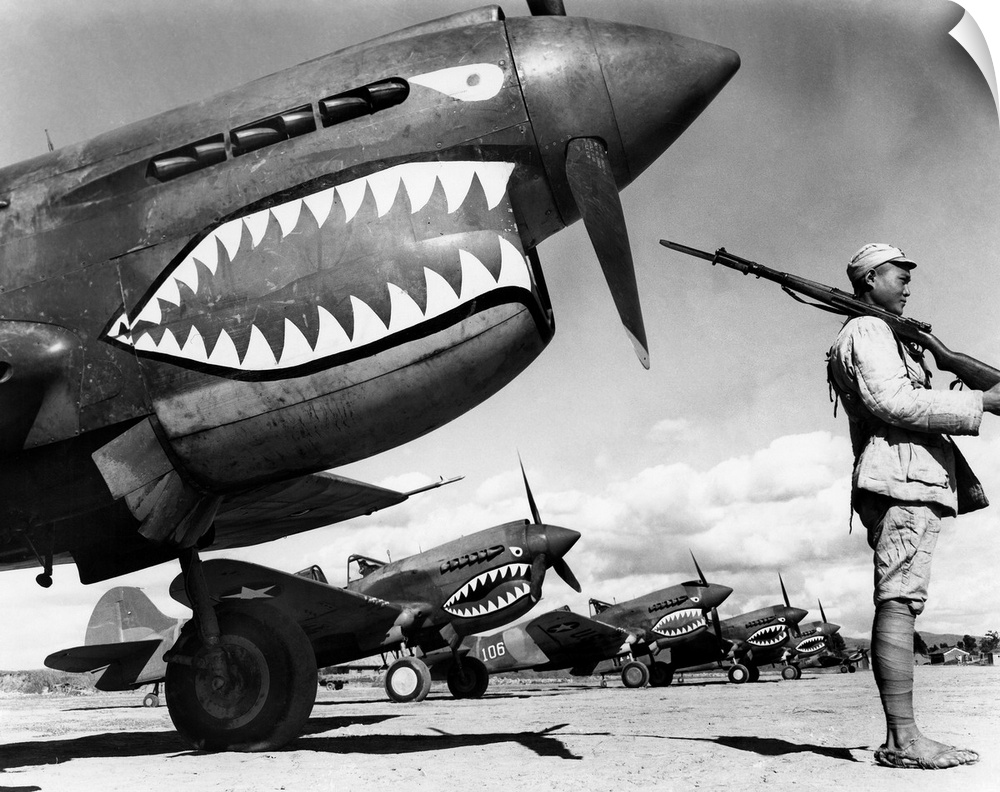 A Chinese soldier guards a squadron of Curtiss P-40 Warhawk fighter planes in China during World War II, 1943.