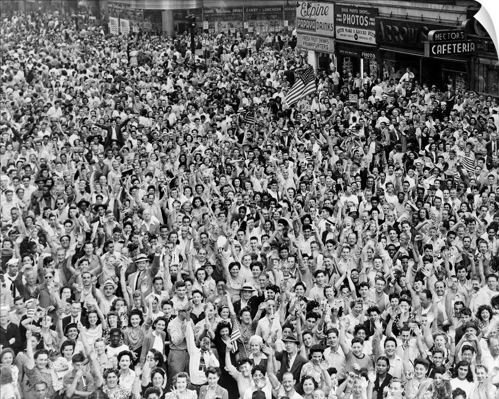 A crowd in Times Square celebrating the surrender of the Japanese at the end of World War II. Photograph by Dick DeMarsico...