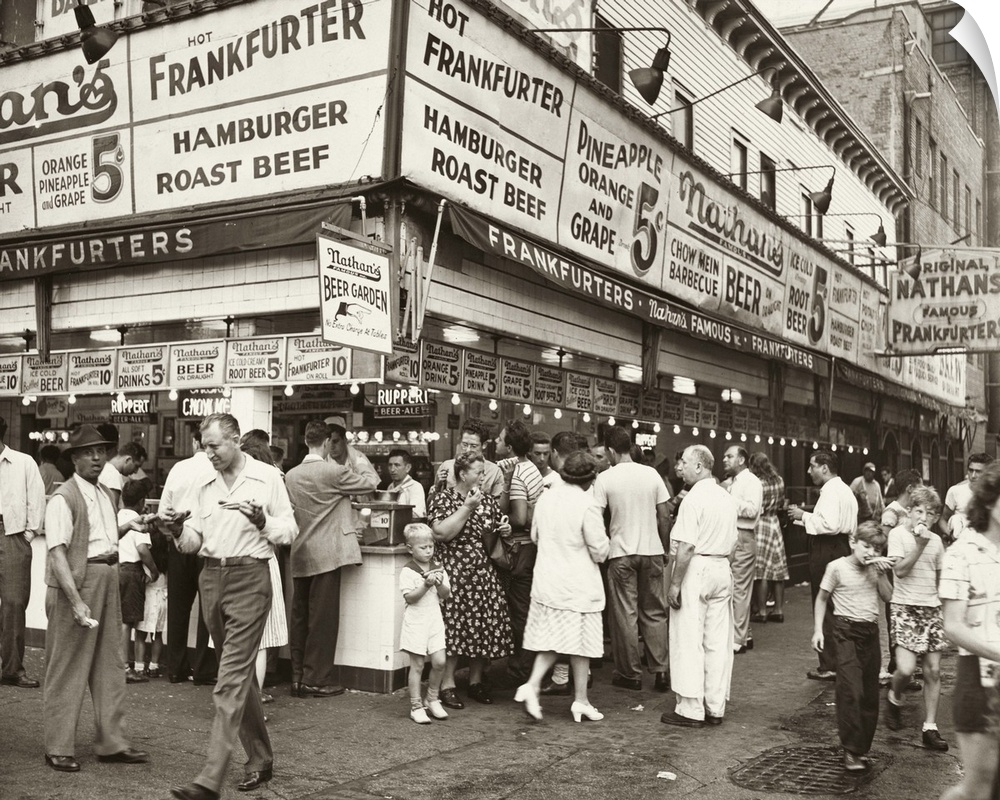 A crowd outside of Nathan's Famous in Coney Island, Brooklyn, New York. Photograph by Al Aumuller, 1947.