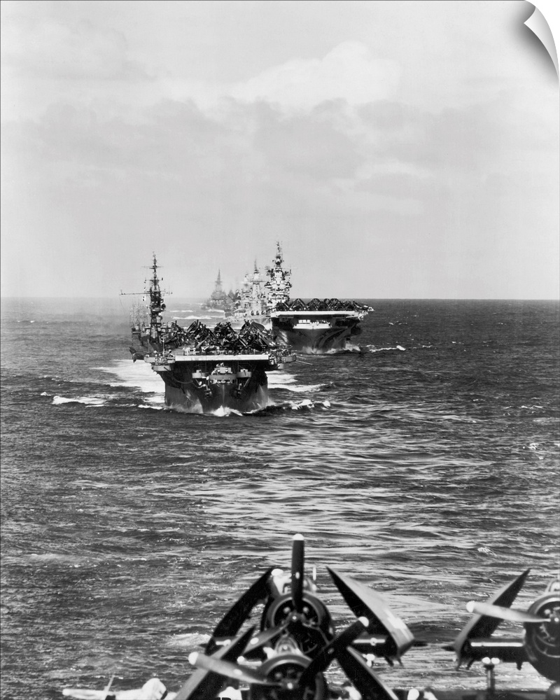 A fleet of aircraft carriers led by USS Langley make their way to the South Pacific, 12 December 1944.