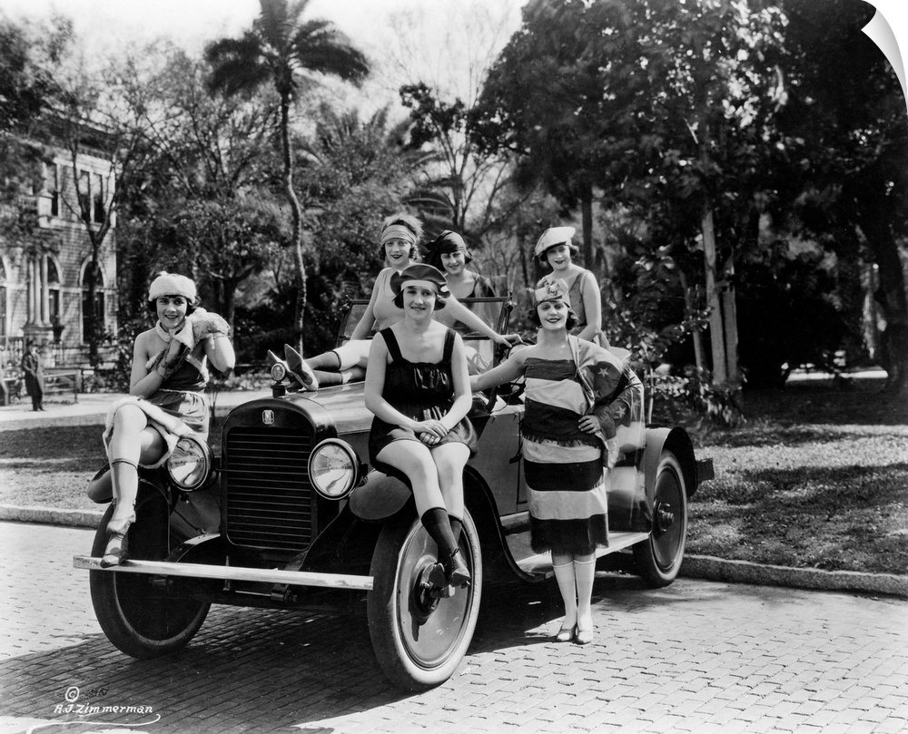 A group of Bathing Beauties posing with a Columbia Six Sport Automobile in Florida, c1920.