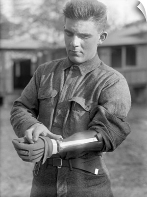 A veteran of World War I wearing a prosthetic arm, 1917
