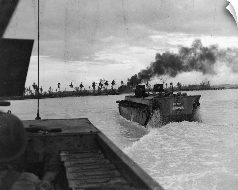 American amphibious tanks landing on Ngesebus Island during the Battle of Peleliu in the present Palau Islands. Photograph...